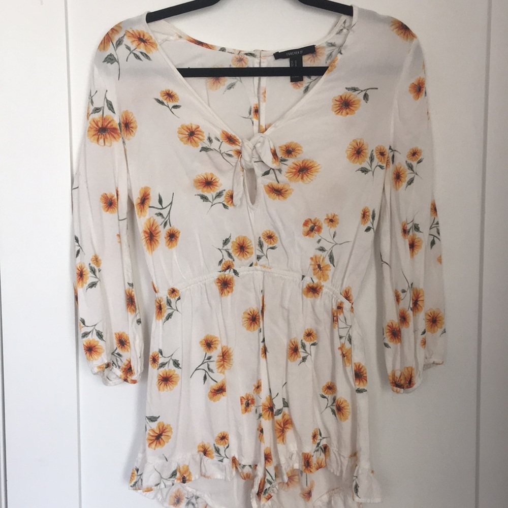 White long sleeve romper with yellow sunflowers